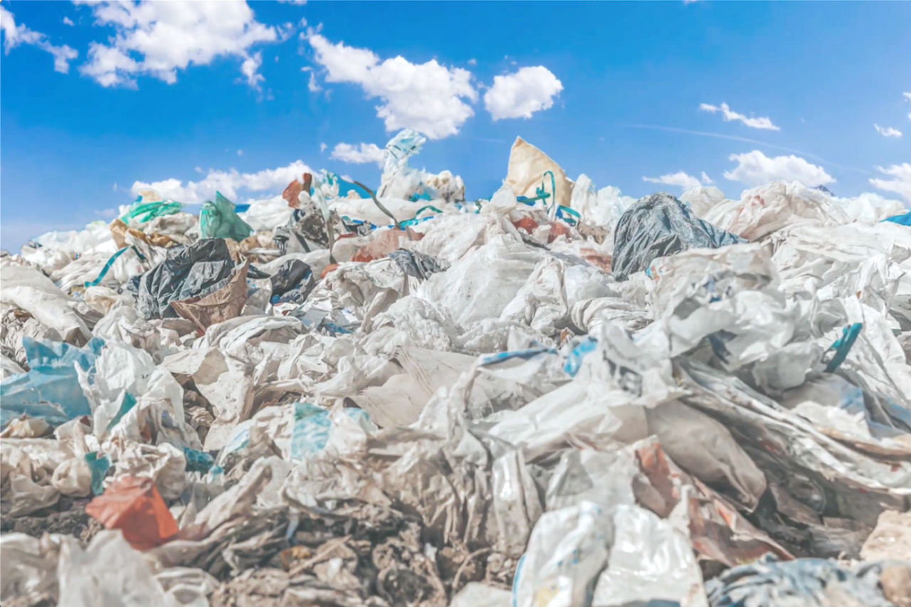 a pile of plastics waste laying in the sun